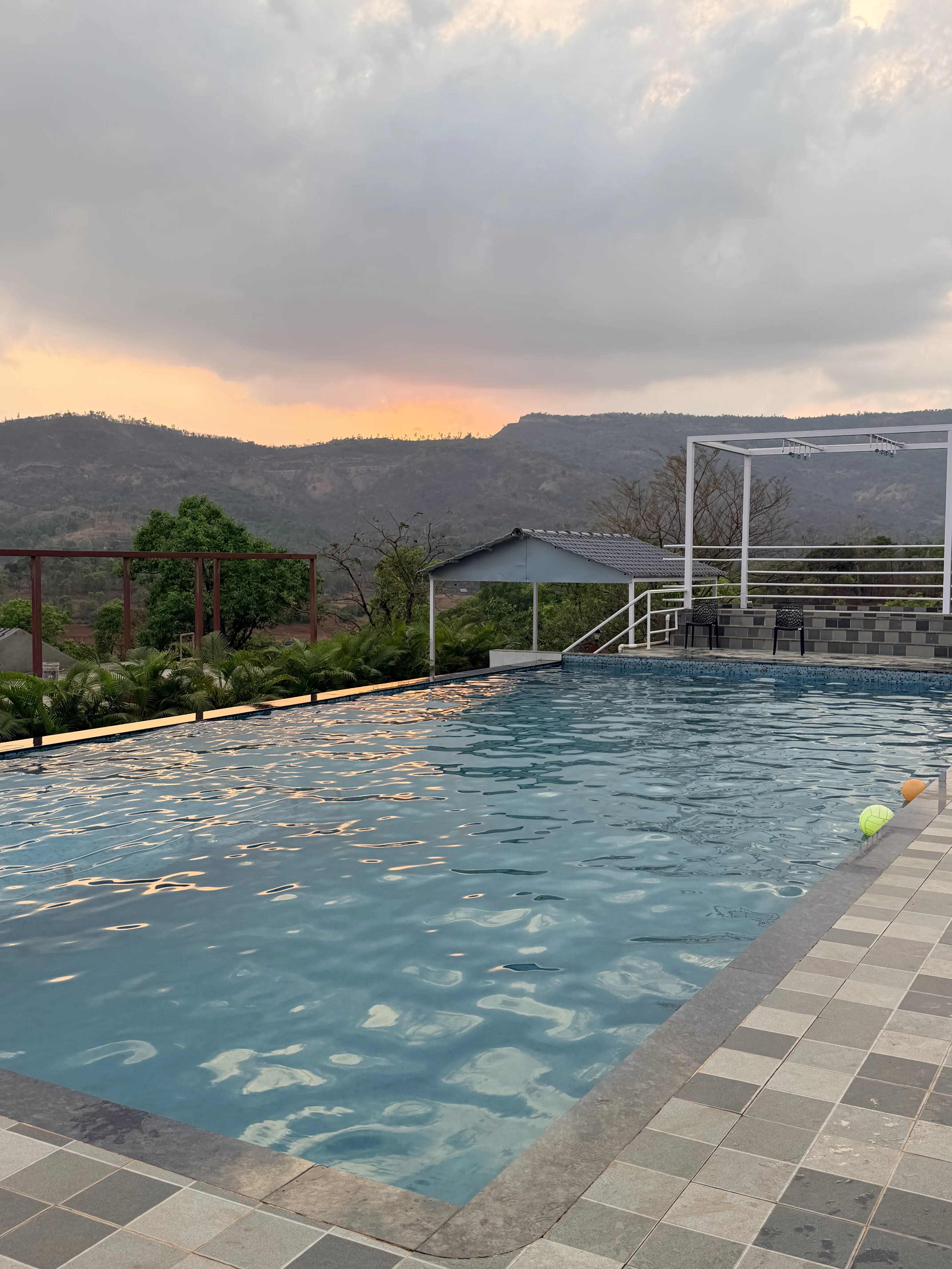 Aerial drone view of Aranyagiri Farmstay Resort Tapola with Shivsagar Lake